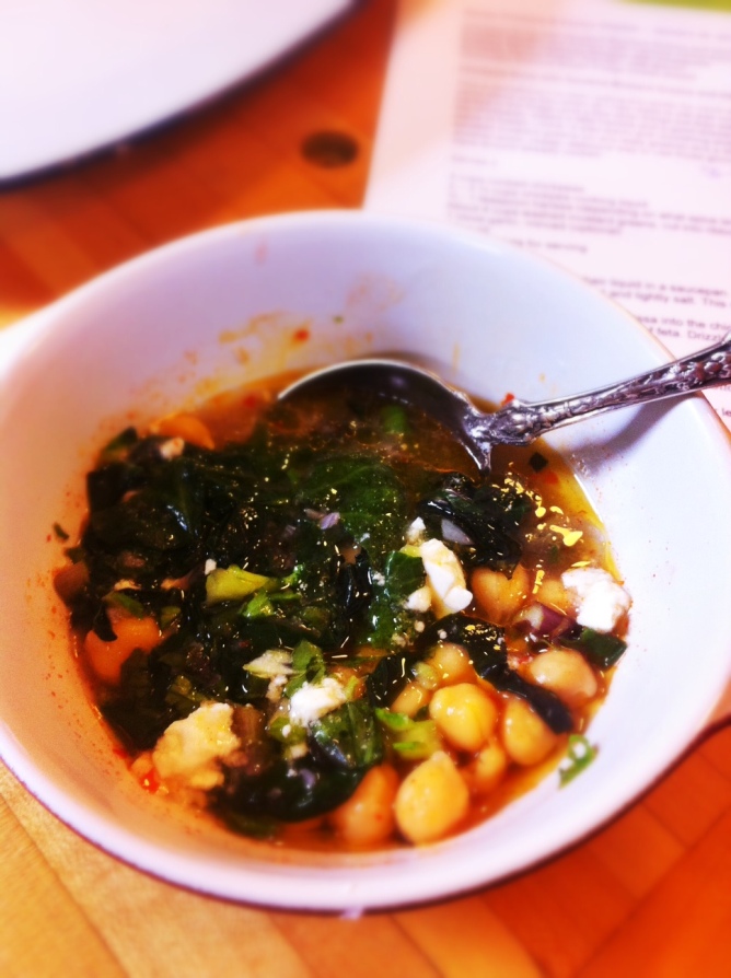 Chickpeas and Harissa topped with mustard greens and feta
